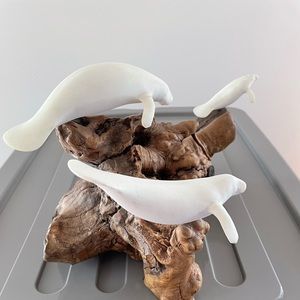 John Perry manatee family sculpture mounted on burl wood